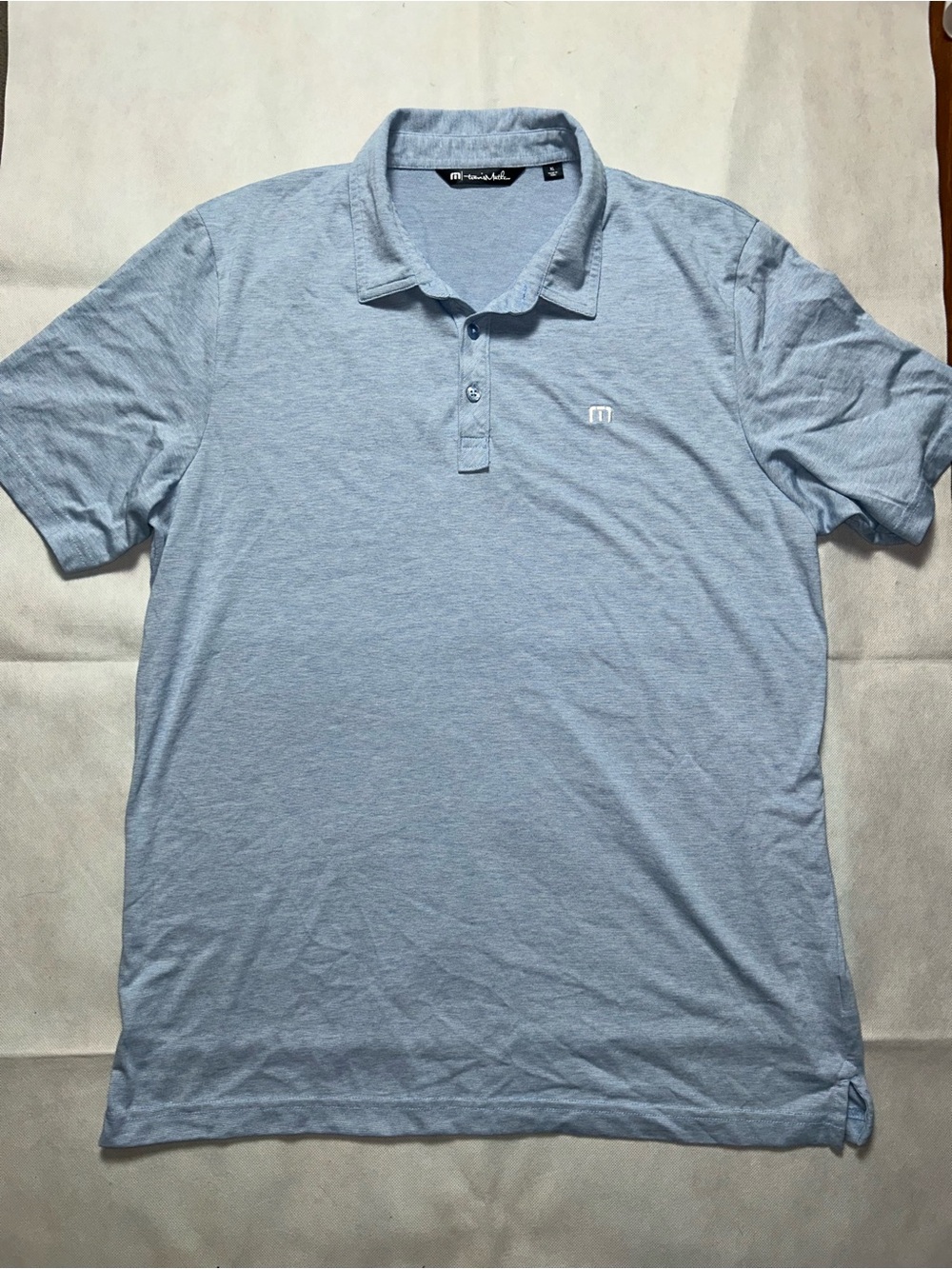 Travis Mathew light blue short sleeve polo size XL